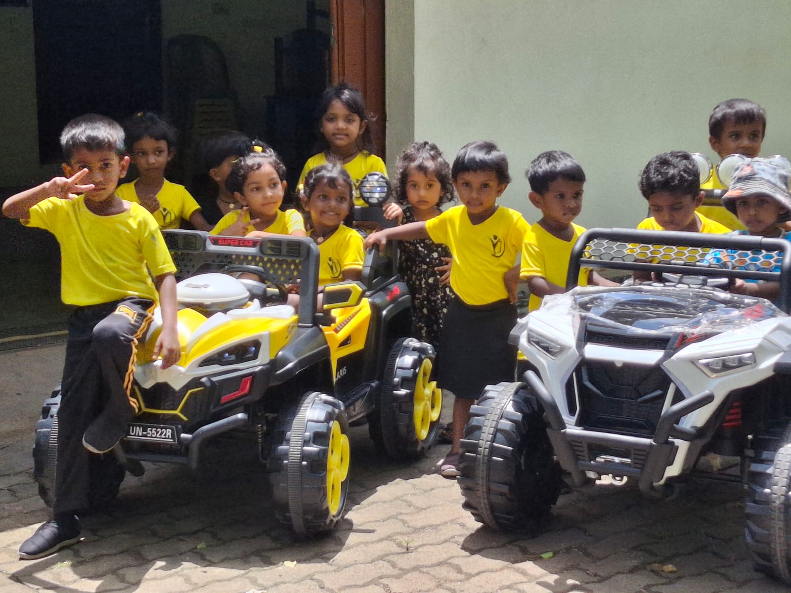 Happy preschoolers playing with colorful blocks